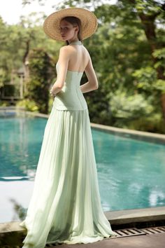 Expertly crafted with luxurious silk, this dress features a flattering A-line silhouette and a chic halter neckline. Perfect for any formal occasion, this floor length dress exudes elegance and sophistication. Elevate your style and make a statement in this timeless piece. Elegant Green A-line Gown, A-line Maxi Dress With Lined Bodice For Gala, Halter Neck Gown For Gala During Prom Season, Elegant Full-length Evening Dress With Pleated Bodice, Summer Wedding Evening Dress With Lined Bodice, Silk Halter Neck Backless Dress For Gala, Elegant Maxi Backless Dress For Prom Season, Elegant Backless Maxi Dress For Prom, Elegant Full Length Gown With Pleated Bodice