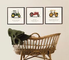 three framed tractors are on the wall above a wicker basket