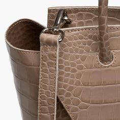 This stylish and effortless medium size bag is handcrafted in Italy with premium c quality crocodile print leather, making it lightweight yet durable. It's easy to clean and maintain, so it'll stay looking as good as new for years to come. With its timeless design and classic look, this tote bag will be a timeless addition to your wardrobe. Whether you're heading out for the day, or going away for the weekend, this midi purse is sure to turn heads wherever you go. Leather Satchel With Crocodile Pattern And Double Handle, Beige Top Handle Bag With Crocodile Pattern, Modern Satchel With Crocodile Pattern, Modern Shoulder Bag With Crocodile Pattern For Daily Use, Modern Rectangular Satchel With Crocodile Pattern, Leather Bags With Crocodile Pattern And Double Handle, Modern Crocodile Pattern Shoulder Bag For Daily Use, Modern Crocodile Pattern Tote Shoulder Bag, Modern Crocodile Pattern Satchel