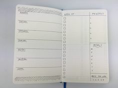 an open notebook with lines and numbers on the page, which is lined in blue