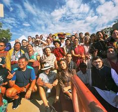 a large group of people are posing for a photo