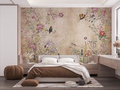 a large bed sitting in a bedroom next to a wall with flowers painted on it