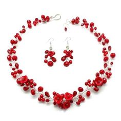 a necklace and earring set with red beads