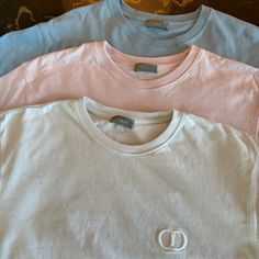 Great Condition Dior Icon T-Shirts. Buy All 3 For Discounted Price Of $900. Originally $650 Each. Designer Pink Short Sleeve Tops, Luxury Pink Tops For Spring, Designer Pink Crew Neck Tops, Designer Blue Cotton T-shirt, Luxury Blue Cotton Tops, Blue Designer Cotton T-shirt, Christian Dior Men, Dior Men, Men Dior