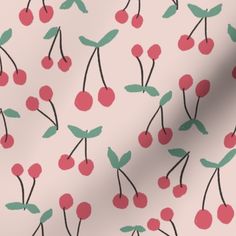 a pink background with cherries and leaves on it