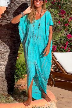 Bring the sunshine and endless summer vibes to any look with this delightful Short Sleeve Irregular Tie Dye Beach Kaftan Maxi Dress. Its whimsical tie-dye design will inspire you to take a much-needed break from the hustle and bustle of everyday life and just enjoy the moment. Brighten up any wardrobe with this sunshine-filled dress!Material:Cotton+PolyesterSIZEUS/CANBUSTWAISTHIPSS2-433"-34"26"-27"36"-37"M6-835"-36"28"-29"38"-39"L10-1237"-39"30"-32"40"-42"XL12-1440"-42"33"-35"43"-45" Turquoise Maxi Dress For Beach Cover-up, Summer V-neck Maxi Dress With Batik Print, Casual Turquoise Maxi Dress For Summer, Blue Bohemian Maxi Dress For Summer, Turquoise Summer Maxi Dress For Vacation, Blue Bohemian Resort Cover-up, Summer Festival Dress With Asymmetrical Hem, Bohemian Turquoise Maxi Dress For Summer, Summer Turquoise Maxi Dress For The Beach