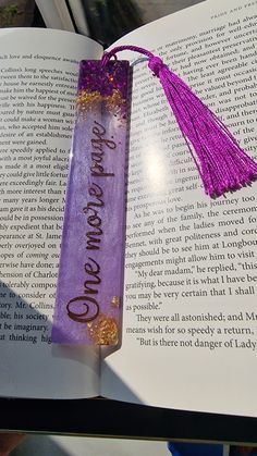 an open book with a tassel on it