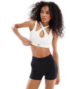 Sportswear by Nike Training Get the right support Suitable for low-impact activities Cross-over straps Nike logo print Pull-on style Modest Fashion Winter, Nike Training, Winter Party Dress, Long Sleeve Floral Dress, Sweaters And Leggings, Sport Bh, Leather Dresses, Satin Slip Dress, Maxi Dress Trend