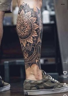 a man's leg with a tattoo on it and an image of a sunflower