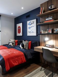 a bed room with a neatly made bed next to a desk and bookcases