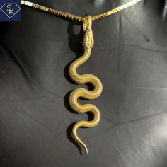 14K Solid Yellow Gold Snake Pendant _ Made In the USA Pendant Dimension: 39.6mm x 9.7mm Chain is not included with this order. Thank you for visiting my store. Please visit us on our website: www.SKCustomJewelry.com CUSTOMER IS SOLELY RESPONSIBLE FOR THE CUSTOM TAXES/IMPORT CHARGES, AND INTERNATIONAL SHIPPING, NO EXEMPTIONS. Luxury Snake Chain Necklaces For Men, Luxury Men's Snake Chain Necklaces, Wooden Jewelery, Petite Engagement Ring, Compass Pendant, Snake Pendant, Gold Snake, Lucky Star, Solid Yellow