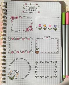 a notebook with some drawings on it and two pens in front of the pages that have flowers