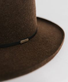 The Lennon is a true showstopper. Featuring a sculpted diamond crown paired with a crisp pencil roll brim, this hat is made for making an entrance. Classic Brown Hat With Flat Crown, Classic Hat With High Crown And Rigid Fit, Classic Hat With High Crown, Classic Brown Felt Hat With Flat Crown, Classic Brown Fedora With Flat Crown, Adjustable Brown Hat With Structured Crown, Elegant Brown Hat Band For Everyday, Elegant Everyday Hat Band With Flat Crown, Classic Fur Felt Hat Band With Flat Crown