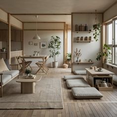 a living room filled with lots of furniture and plants on the wall next to windows