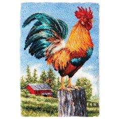 a colorful rooster standing on top of a wooden post in front of a rural landscape