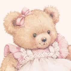 a brown teddy bear wearing a pink and white dress