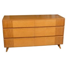 a large wooden dresser with three drawers