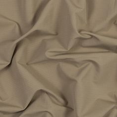 a close up view of a tan fabric