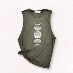 ✿ WELCOME TO MY SHOP ✿ More Shirt ► https://www.etsy.com/shop/igetherproject Material : Polyester 80% Cotton 20% Sleeve length : Yoga tank top, workout tee tank Styles : arm holes are low Women Fit. Printed with eco-friendly water-based inks. Color shirt : Pink ,Heather grey and Olive Green Color print : White & black , etc ■ WASHING INSTRUCTIONS ■ Turn garment inside out. Hand wash. Lay flat to dry. Do not bleach/dry-clean Do not iron directly onto the print ■ Please refer to the size chart in the last image of the listing ■ Measurement Size Small ► Width = 36 inches. ( round ) ► Length = 24 inches. ► Sleeveless length 11 inches. Size Medium ► Width = 38 inches. ( round ) ► Length = 26 inches. ► Sleeveless length 12 inches. Size Large ► Width = 41 inches. ( round ) ► Length = 27 inches. ► Full Moon Shirt, Moon Phases Shirt, Tank Top Workout, Moon Graphic, Yoga Tank Top, Moon Shirt, Kim Kardashian Red Carpet, Jenner Outfits, Yoga Tank Tops