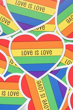 rainbow hearts with love is love stickers on the bottom one has words that read love is love, and the other says love is love