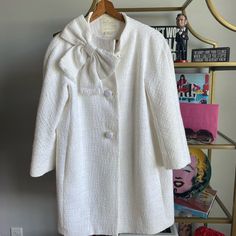 Kate Spade White Coat. Beautiful Bow Detail. 3 Buttons. True To Size. Please Note The Sleeves Are Not Full Length. Dry Clean Only. Worn Twice In Great Condition. 2 Marks Please See Last 2 Pictures. Barely Noticeable.I Have Not Dry Cleaned Her Yet So Will Probably Come Out. Elegant Cream Outerwear For Daywear, White Vintage Outerwear For Formal Occasions, Fitted Kate Spade Outerwear For Spring, Elegant Kate Spade Outerwear For Work, White Vintage Formal Outerwear, Fitted Kate Spade Spring Outerwear, White Double-breasted Pea Coat For Winter, Elegant Kate Spade Spring Outerwear, Kate Spade Fitted Spring Outerwear