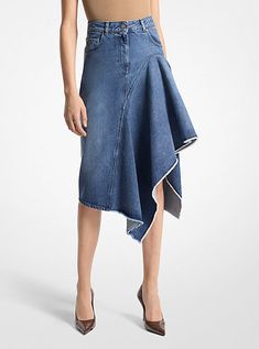 Imbued with an architectural edge, this denim skirt features asymmetrical, cascading ruffles that descend to a flattering knee-grazing length. Italian-made, this skirt is crafted from organic cotton for an effortless drape and soft handle. Wear it with a leather belt to further define the high-rise waist. Reworked Denim Skirt, Cascade Skirt, Streetwear Skirt, Denim Wrap Skirt, Reworked Denim, Quilted Skirt, Cascading Ruffles, Upcycle Jeans, Michael Kors Collection