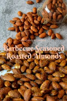 a jar filled with roasted almonds sitting on top of a table