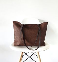 "Large tote bag made of good quality vegan faux leather in rich chocolate brown color with distressed look. The material is very soft and has matte finish. *Cotton lining in light brown * Two slip inner pockets *Magnetic snap closure. *The straps are made of cowhide leather in dark brown for extra support. This is the perfect carry-all bag! It is large but at the same time very light . Goes perfectly with any outfit! Dimensions: Opening: 17\" Height: 13\" Depth: 3\" *Please note that the color m Brown Everyday Bags With Handles, Everyday Vintage Brown Bag, Vintage Brown Tote Satchel For Daily Use, Vintage Brown Bags With Leather Handles For Daily Use, Large Capacity Vintage Brown Satchel For Everyday Use, Brown Double Handle Bag For Everyday, Brown Satchel With Handles For Everyday, Everyday Vintage Brown Large Capacity Shoulder Bag, Everyday Vintage Brown Shoulder Bag With Large Capacity