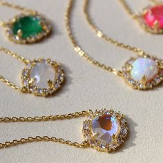 More views of the prettiest, shimmery floral gemstone necklace👉🏼Now available in Kyocera Opal, Created Emerald, two brand new shades of Dichroic Glass✨ #necklaces #layeringnecklaces #floraljewelry #opal #jewelry #jewelrydesigner #jewelrygram #styleinspo #dallas Dainty Round Jewelry For Parties, Dazzling Round Emerald Necklace, Dazzling Gemstone Round Pendant Necklace, Delicate Round Gemstone Crystal Necklaces, Spiritual Crystal Jewelry With Gemstones, Round Crystal Necklaces With Sparkling Stones For Party, Party Crystal Necklaces With Sparkling Stones, Crystal Jewelry For May Birthstone Gift, Crystal Jewelry Gift For May Birthstone