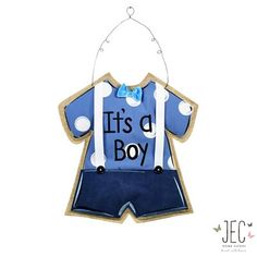 it's a boy ornament with blue shorts and suspenders on the front