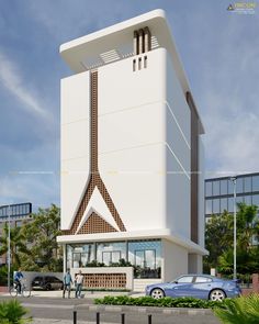 a large white building sitting on the side of a road next to a parking lot