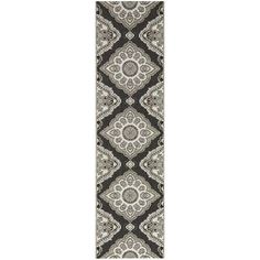 a black and white runner rug with an ornate design