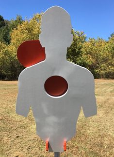 a sculpture in the shape of a man with two circles on his chest and back