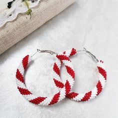 Candy cane beaded hoop earrings. ♥ SIZE (approximately diameter) :1.1 inch1.4 inch1.6 inch2.2 inch ♥ 100% handmade♥ Packed in gift box)))♥ Very light♥ If you like this item in a different color - send me a message, please. Feel free to communicate with me__________________________________________________Advice on use and care* Never wear any jewelry while bathing or showering. Chlorine can cause damage. Please do not swim and did not take a shower in beaded jewelry* Try to avoid the drop, shock Packing Jewelry, Handmade Earrings Beaded, Christmas Bead, Large Hoop Earrings, Beaded Hoop Earrings, Beaded Hoops, Christmas Earrings, Seed Bead Earrings, Bead Jewellery