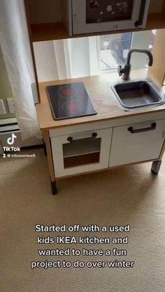 a kitchen with a stove top oven next to a microwave