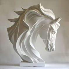 a sculpture of a white horse with long manes