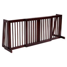 a baby gate with wooden slats on the top and bottom bars in dark wood