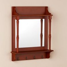 a mirror and coat rack on a wall