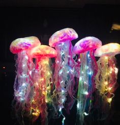 some jellyfish lights are hanging in the dark