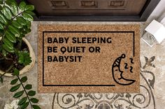 a door mat that says, baby sleeping be quiet or babysitt on it