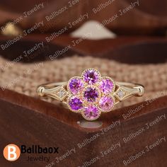 "MADE TO ORDER * Material: Solid gold(10K/14K/18K white/yellow/rose gold), Platinum * DETAILS - Center Stone: Lab Created Pink Sapphire - Center Stone Size: Round Cut 2.5mm*7psc - Center Stone  Carat Weight: Approx 0.56ct - Side stone: Natural Diamond - Total weight: 0.01 ctw (High Quality) - Cut: Round - Color: DF -  Clarity: VVS - Band Width: 1.5mm * Click on the \"Pin It\" icon if you like this item ✥ O T H E R ∙ I N F O R M A T I ON ✥ ♦ Your item will be nicely packed to gift in elegant jewelry boxes. ♦ Custom Order We can make custom rings in almost any shape and style. If you want a specific model, please send us a clear picture and we will do our best. ♦ Shipping Most items take 3-4 weeks to create.I'm happy to rush your order, fees may apply, write me for details. ♦ Payment Plans I Flower Shaped Yellow Gold Diamond Ring As A Gift, Yellow Gold Flower Ring As A Gift, Yellow Gold Flower Ring Gift, 14k Rose Gold Flower Ring For Anniversary, Rose Gold Flower Ring Stamped 14k For Anniversary, Rose Gold 14k Cluster Ring Gift, 14k Yellow Gold Flower Cluster Ring, Gift 14k Rose Gold Cluster Ring, Gift Rose Gold Cluster Ring In 14k Gold