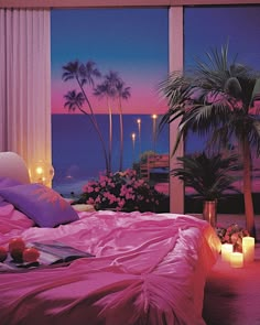 a bed with pink sheets and pillows in front of a window overlooking the ocean at night