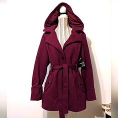 For Size Reference Was Modeled On A Small Mannequin. Brand New With Tags, Never Worn. Beautiful Shade, The Tag Says Crushed Violet, Looks Like A Wineish Color. Long Sleeves That Have A Wide Cuff, Perfect For Rolling Up. Behind The Collar Is A Hood That Has Buttons So You Can Remove It. Wide Lapel With Three Button Closure, Pockets On Each Side. Belt Loops, Fabric Tie Belt Is Attached In The Back With Grommets, Also On Both Pockets. Pit To Pit Buttoned Up Is 22", Length Is 39", Below The Hips. Co Hooded Burgundy Outerwear For Winter, Hooded Burgundy Outerwear For Fall, Burgundy Hooded Outerwear For Winter, Purple Winter Outerwear With Drawstring Hood, Winter Purple Outerwear With Drawstring Hood, Purple Outerwear With Drawstring Hood For Fall, Purple Fall Outerwear With Drawstring Hood, Fitted Purple Winter Outerwear, Hooded Purple Outerwear For Fall