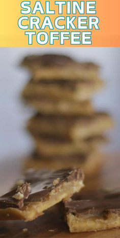 a stack of saltine cracker toffee on top of a wooden table