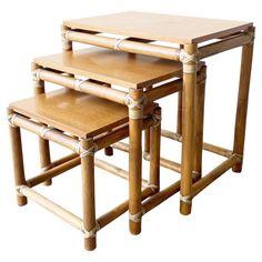 three pieces of bamboo furniture stacked on top of each other