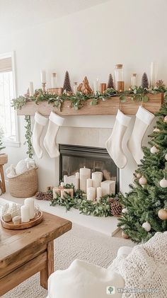 a living room decorated for christmas with stockings and candles