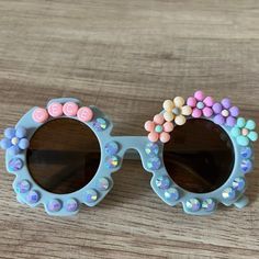 Personalized kids flower sunnies for some springtime cheer. These make the cutest Spring accessory or basket stuffer. Sunnies fit children around age 2-10. TO ORDER:There are a few ways to customize the sunglass style, beads, and colors: Select Bead Design: There is a wide selection of beads to choose from. Reference picture for options. Add Sparkle: Option to add pearls or rhinestones around the lenses, or no sparkle. Reference picture for options. Select Name Bead Color: Choose between white o Fun Multicolor Sunglasses For Spring, Fun Multicolor Spring Sunglasses, Playful Multicolor Sunglasses For Spring, Cute Summer Sunglasses For Birthday, Cute Blue Sunglasses For Summer, Cute Blue Summer Sunglasses, Fun Pink Handmade Sunglasses, Whimsical Beach Sunglasses With Uv Protection, Whimsical Sunglasses With Uv Protection For Beach