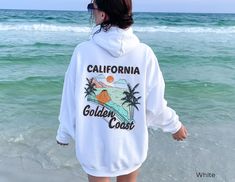 California Sunset Hoodie Beach, Oversized Hoodie, Beachy Sweatshirt, Summer Beach Hoodies Surfer Hawaii Hoodie, Hawaii Sweatshirt, Trendy Beach Hoodie, Gifted Hoodies vacation ♥ PRODUCTION TIME: 1-5 days (Usually 2-3 days) ♥ SHIPPING TIME: 2-5 days (Usually 3 days) ♥ PRODUCT DESCRIPTION: Gildan 18500 Unisex Hoodie 50% cotton, 50% polyester Made from specially spun fibers that make for a very strong, smooth fabric which is perfect for printing. Polyester fibers are extremely resilient, resistant White Letter Print Hoodie For Beach Season, Casual White Hoodie For Beach Season, White Graphic Print Beach Hoodie, White Graphic Print Hoodie For Beach, Oversized Sweatshirt For Beach Vacation, Oversized Hoodie For Beach Season Streetwear, Oversized Sweatshirt For Beach Season Vacation, Oversized Hoodie Sweatshirt For Beach, White Long Sleeve Hoodie For Beach