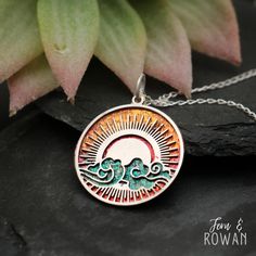 This Colorful Sun Pendant Necklace is a beautiful gift for those enchanted with nature!  This necklace features a Stainless Steel and a brass disk that have been carefully handmade and painted in our studio. In Chinese culture, clouds symbolize the celestial realm between heaven and earth. Today it is seen as a sign of change, daydreams, and emotions. This beautiful necklace has a eye-catching appearance that would look great with any outfit! This Stainless Steel and Brass pendant measures 28 mm Sunset Necklace, Cloud Pendant, Sun And Clouds, Summer Necklace, Brass Pendant, Chinese Culture, Matching Earrings, Fern, Beautiful Necklaces