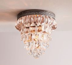 a chandelier hanging from the ceiling in a room